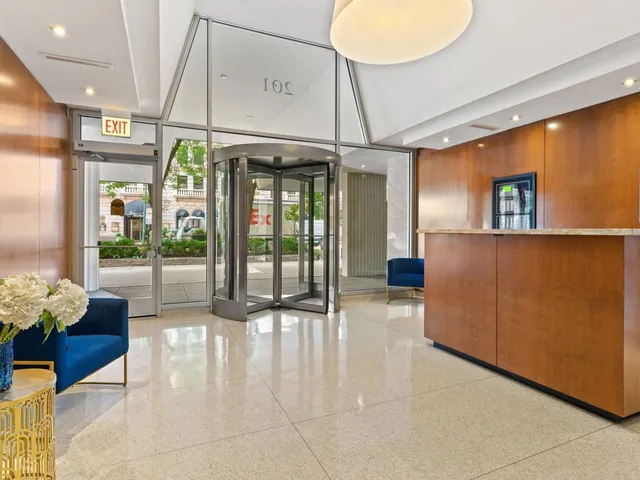 a lobby with furniture and window