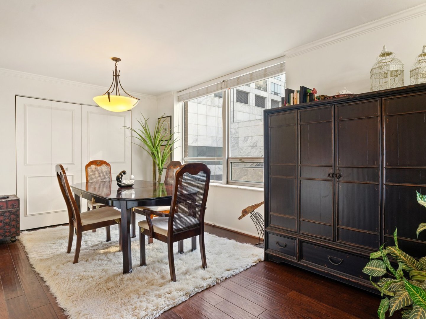 201 East Chestnut Street, Unit 23A Chicago, IL 60611 - Photo 7 of 21 a dining room with furniture and window