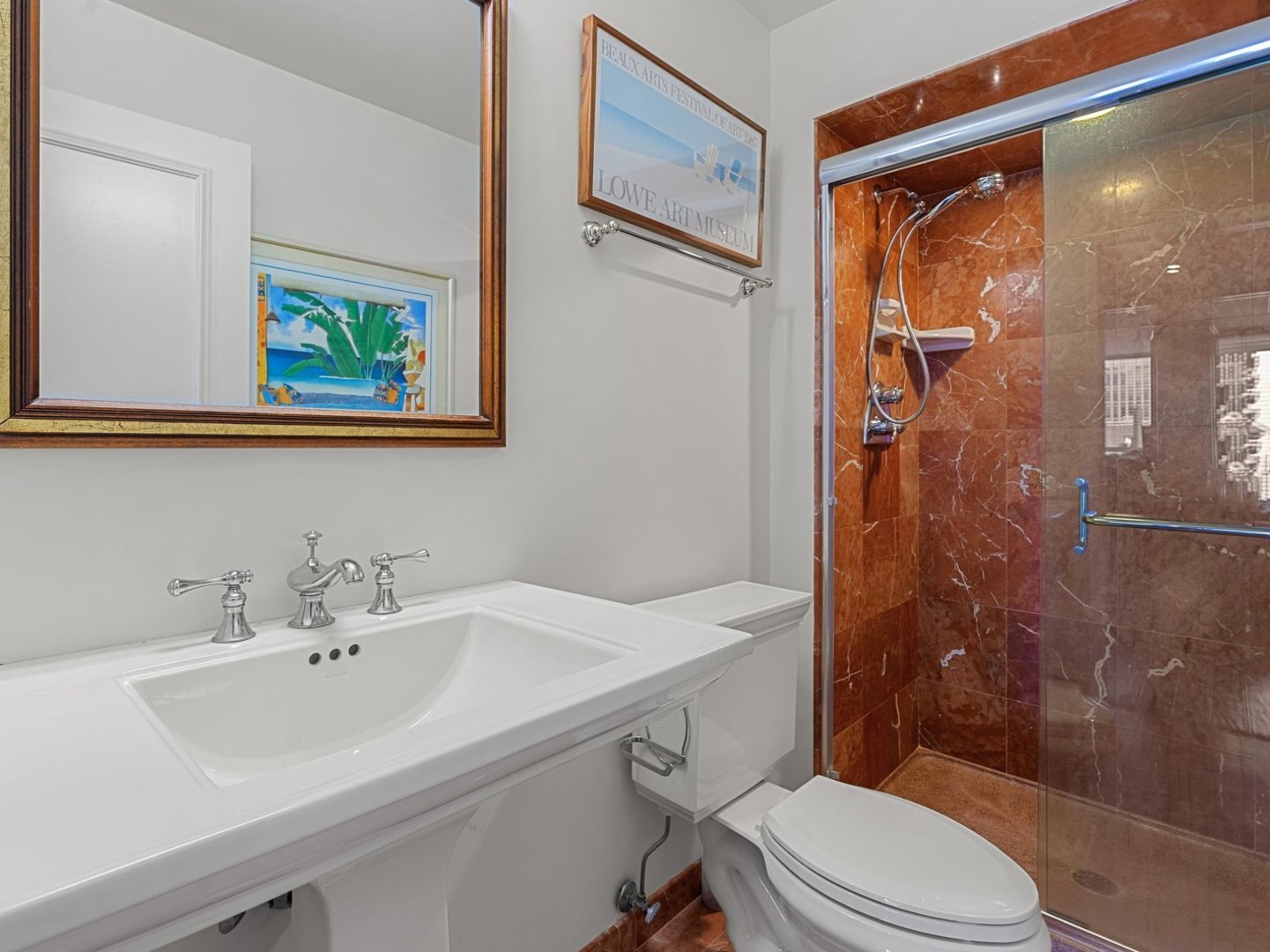 201 East Chestnut Street, Unit 23A Chicago, IL 60611 - Photo 9 of 21 a bathroom with a sink mirror toilet and shower