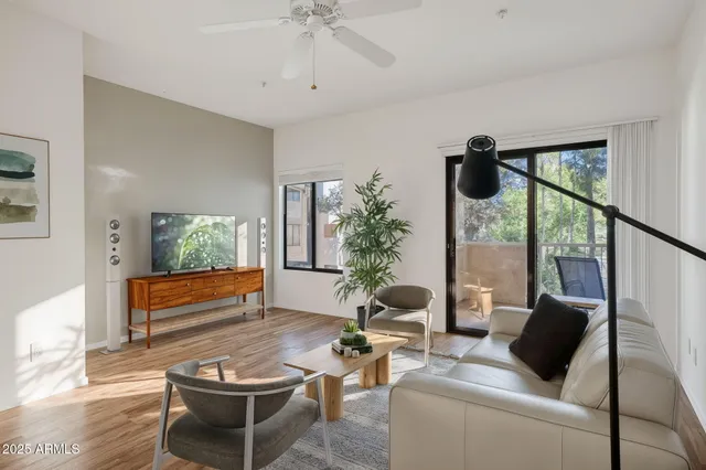 a living room with furniture and a large window