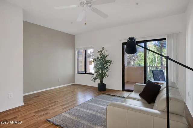 a living room with furniture and a window