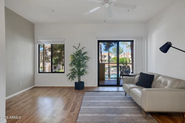 a view of balcony with wooden floor and outdoor seating