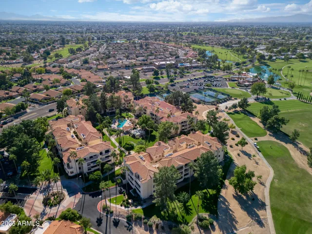 an aerial view of a house with a big yard