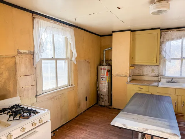 a kitchen with stainless steel appliances a stove and a refrigerator