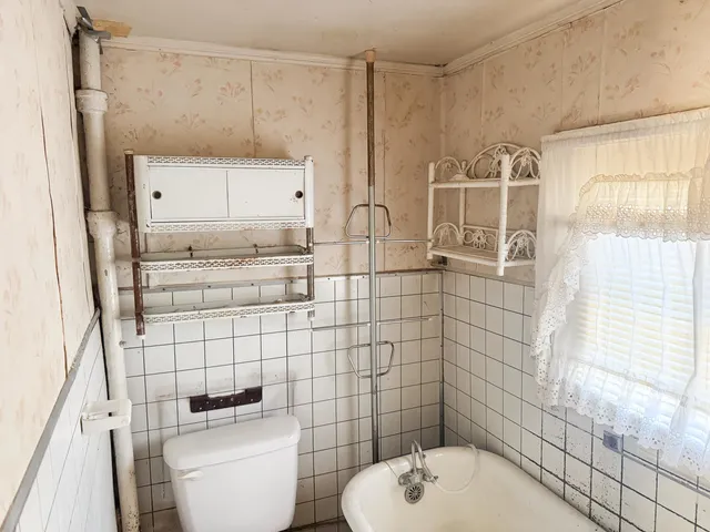 a bathroom with a bathtub and shower