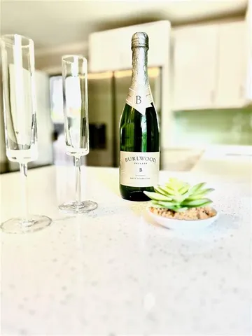 a picture of a bathroom with sink and mirror