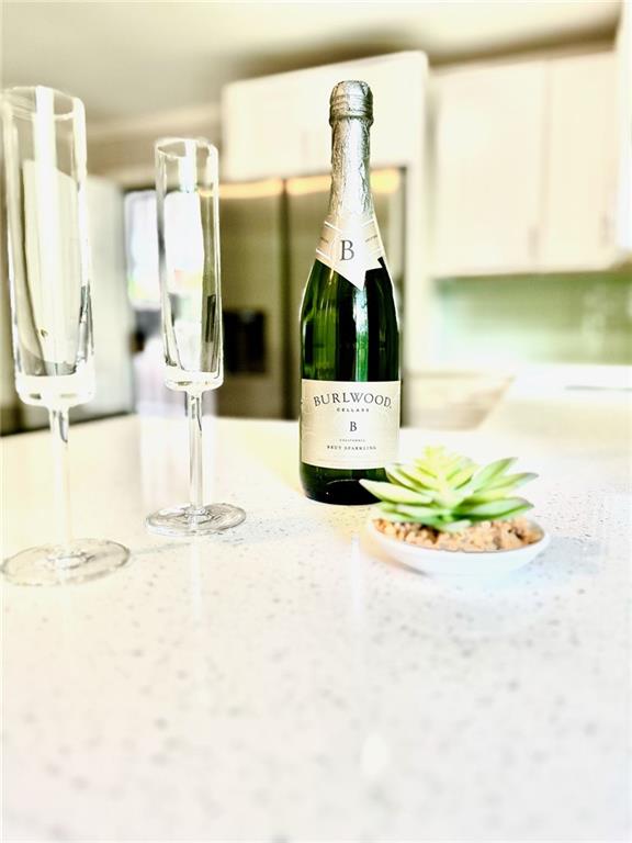 a picture of a bathroom with sink and mirror