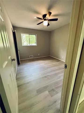a view of an empty room and a window