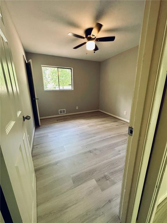 1726 Fairburn Road Southwest Atlanta, GA 30331 - Photo 9 of 12 a view of an empty room and a window