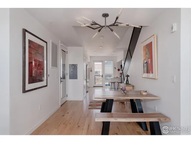 a open kitchen with stainless steel appliances a refrigerator and cabinets