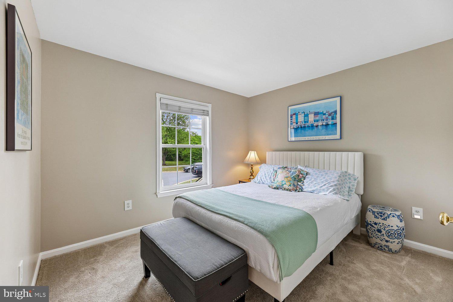 3707 Turn Back Trail Triangle, VA 22172 - Photo 34 of 55 a bedroom with a bed and wooden floor