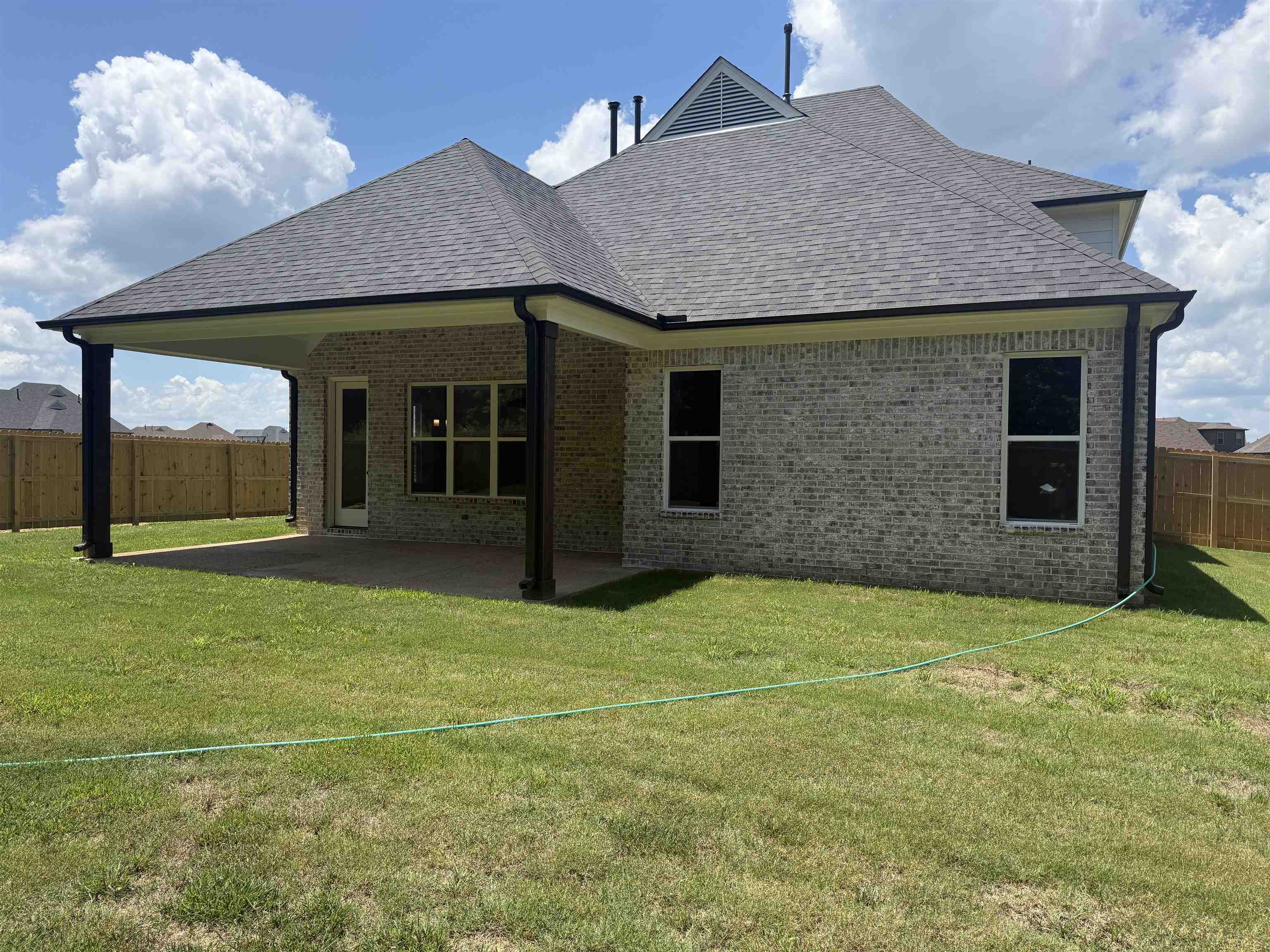 85 Ridgefield Drive Oakland, TN 38060 - Photo 10 of 12 a view of a brick house with a yard