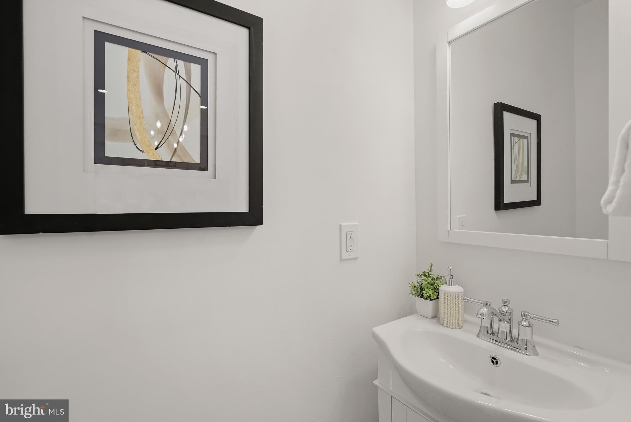 3719 R Street Northwest Washington, DC 20007 - Photo 8 of 44 a bathroom with a sink and a mirror