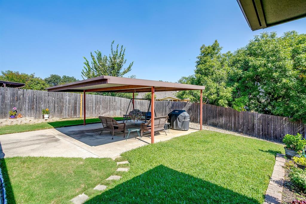 1116 Highpoint Road Bedford, TX 76022 - Photo 34 of 37 Fenced backyard featuring a patio