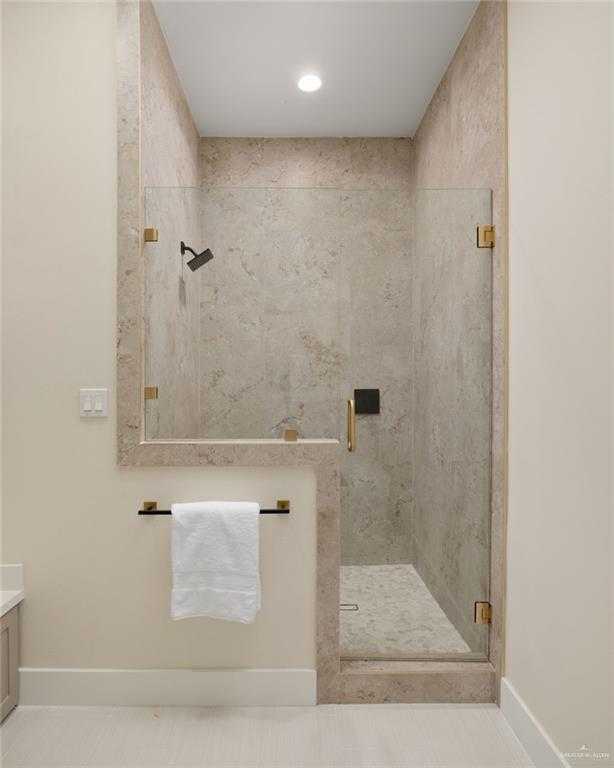 7820 North 38th Street McAllen, TX 78504 - Photo 15 of 31 Full bathroom featuring a marble finish shower, vanity, and recessed lighting