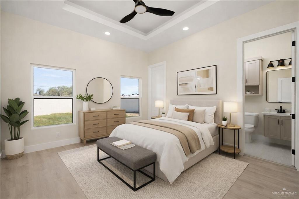 7820 North 38th Street McAllen, TX 78504 - Photo 21 of 31 Bedroom featuring ceiling fan, light wood-style flooring, a raised ceiling, ensuite bath, and recessed lighting