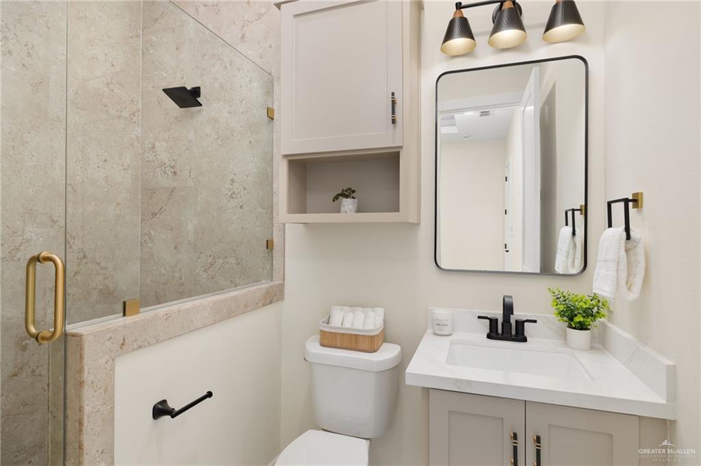 7820 North 38th Street McAllen, TX 78504 - Photo 23 of 31 Full bathroom with a stall shower and vanity