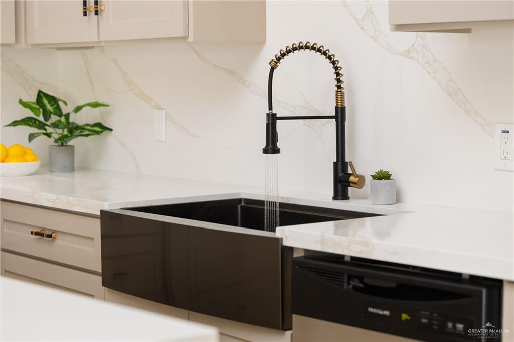 7820 North 38th Street McAllen, TX 78504 - Photo 7 of 31 Kitchen with stainless steel dishwasher and light stone counters