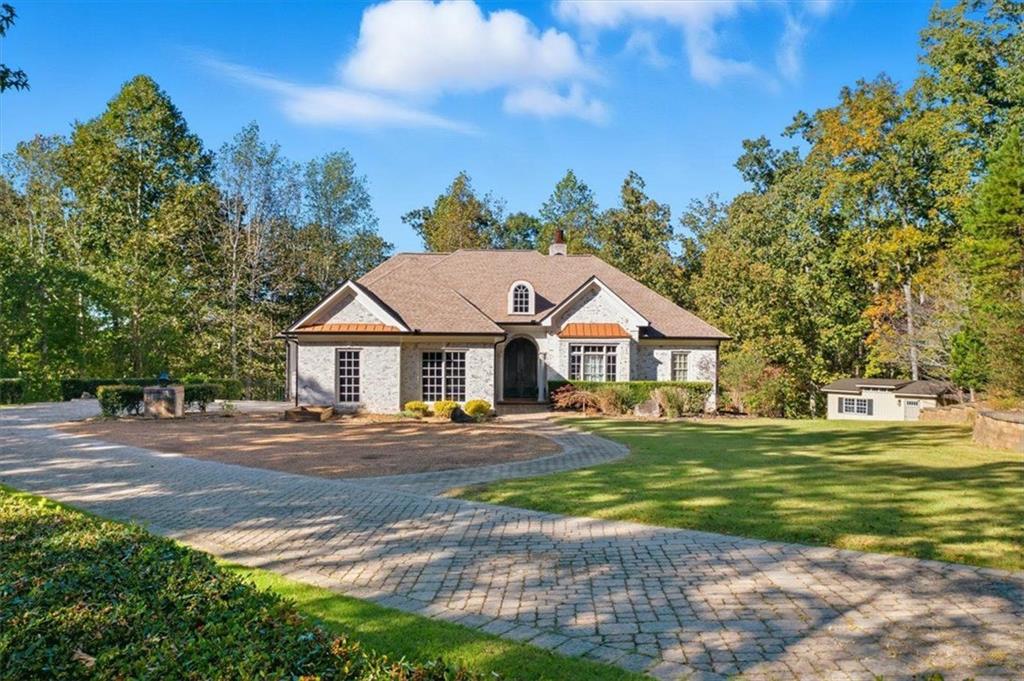 a front view of a house with a yard