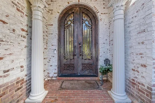 a living room with furniture a fireplace and a table