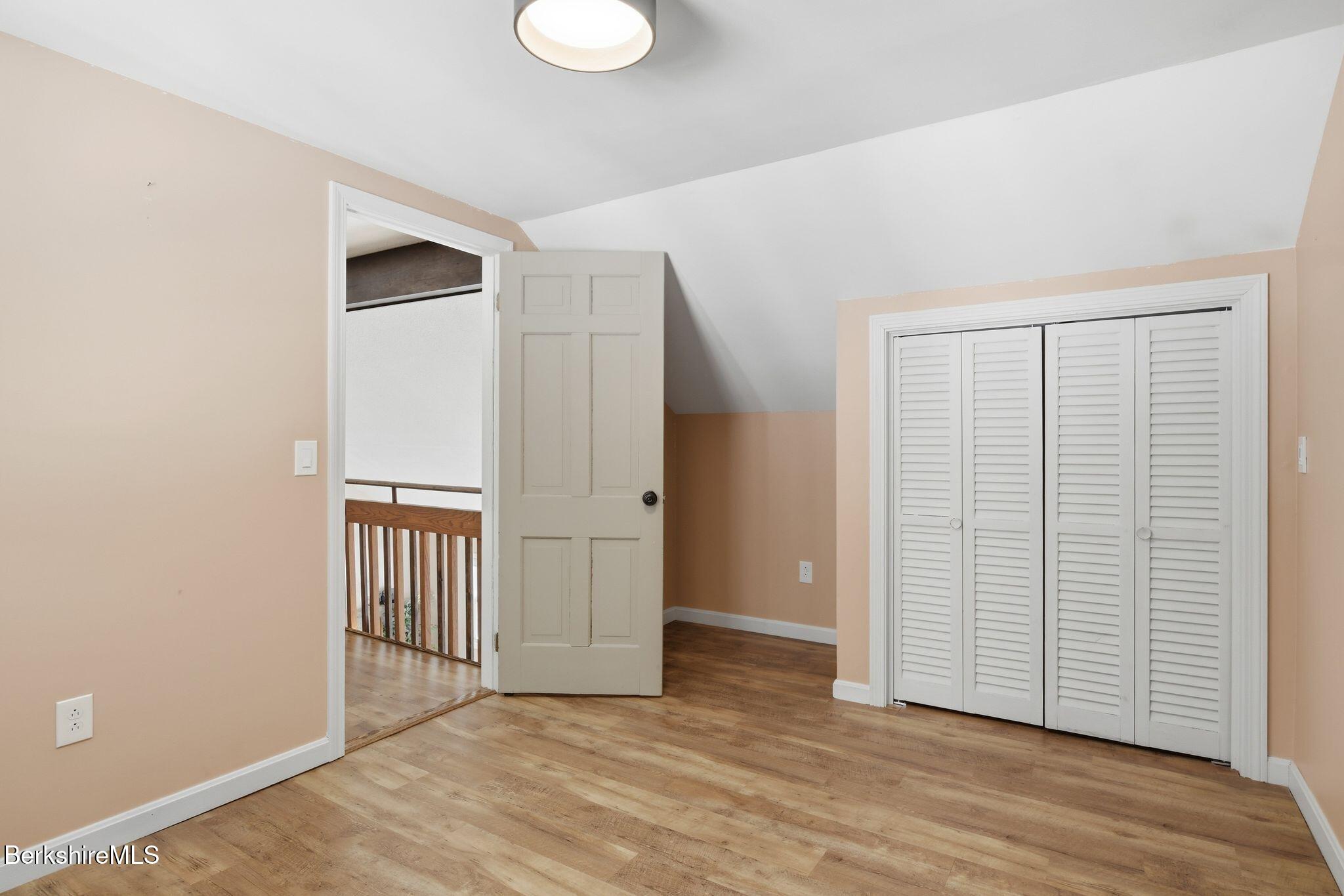 30 Gore Road Blandford, MA 01008 - Photo 33 of 61 an empty room with wooden floor and windows