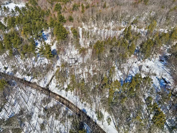 a view of a house with a snow on the ground