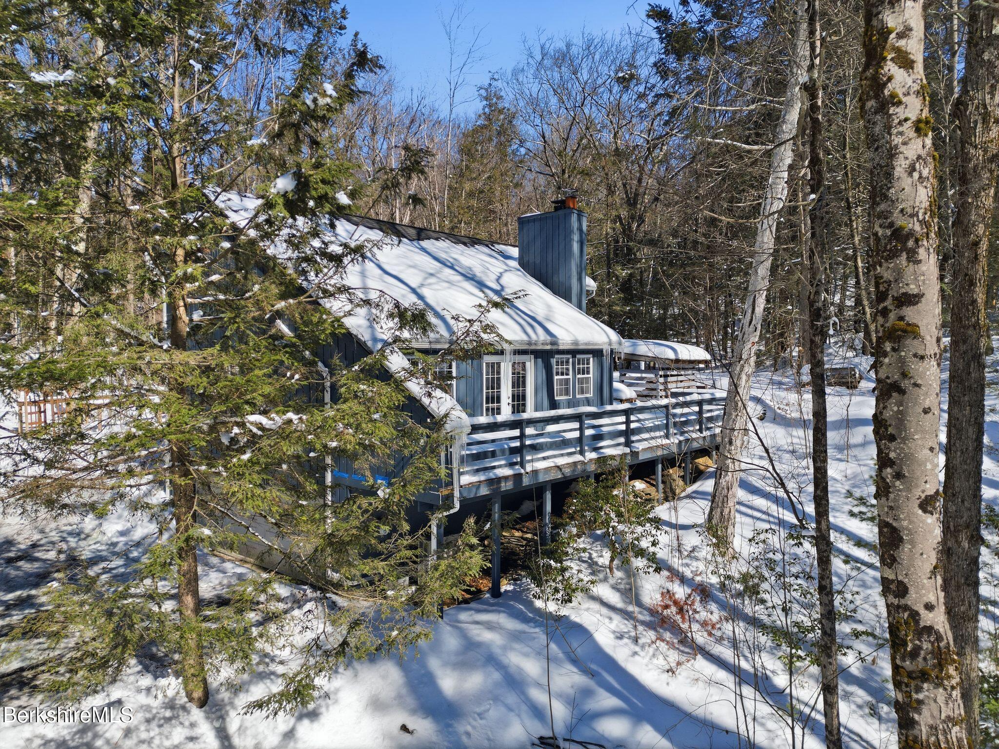 30 Gore Road Blandford, MA 01008 - Photo 55 of 61 a view of a house with a yard and sitting area