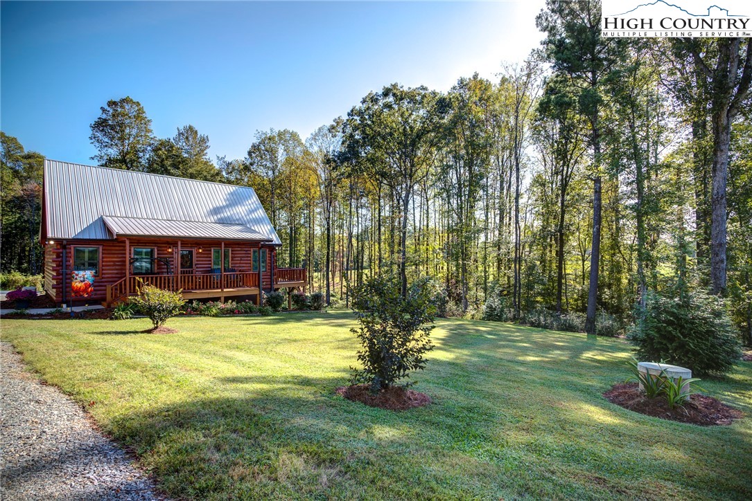 3460 South Center Church Road Thurmond, NC 28683 - Photo 3 of 50 a view of a house with a yard