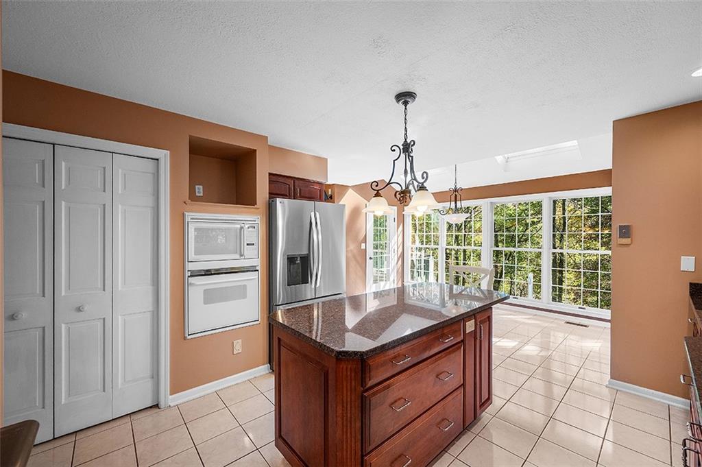 409 Bryn Court Pittsburgh, PA 15237 - Photo 15 of 50 a kitchen with stainless steel appliances granite countertop a sink and a refrigerator