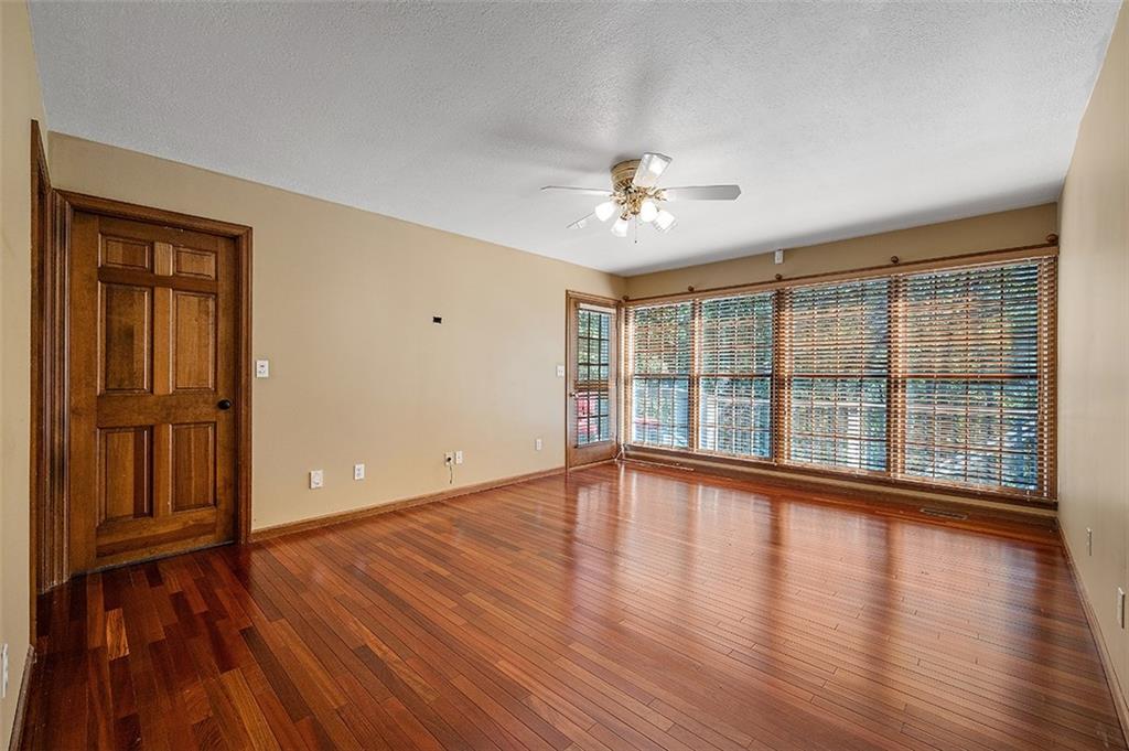 409 Bryn Court Pittsburgh, PA 15237 - Photo 17 of 50 a view of an empty room with wooden floor and a window