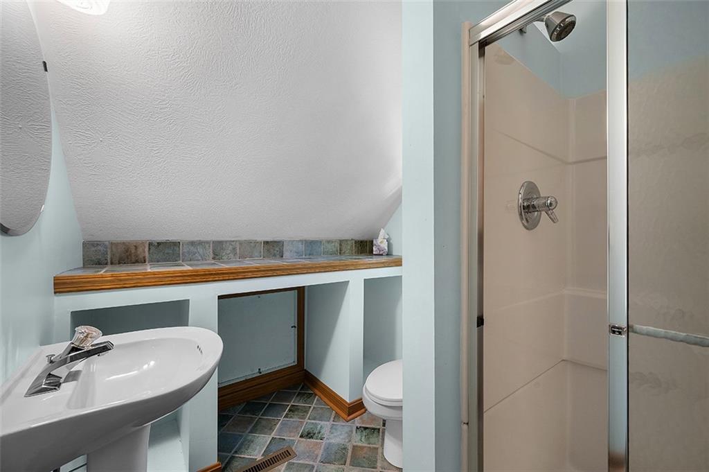 409 Bryn Court Pittsburgh, PA 15237 - Photo 30 of 50 a bathroom with a sink mirror vanity and toilet