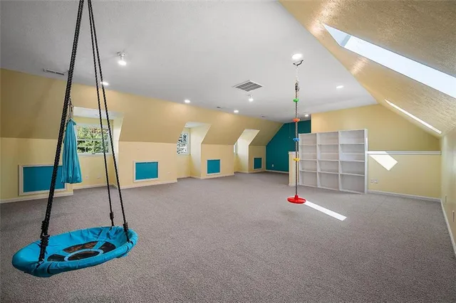 a view of a kitchen with a sink and dishwasher next to a window