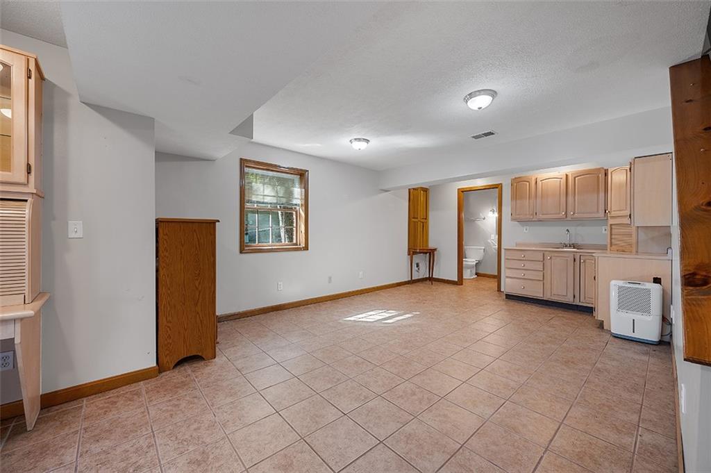 409 Bryn Court Pittsburgh, PA 15237 - Photo 35 of 50 an empty room with a empty space and windows