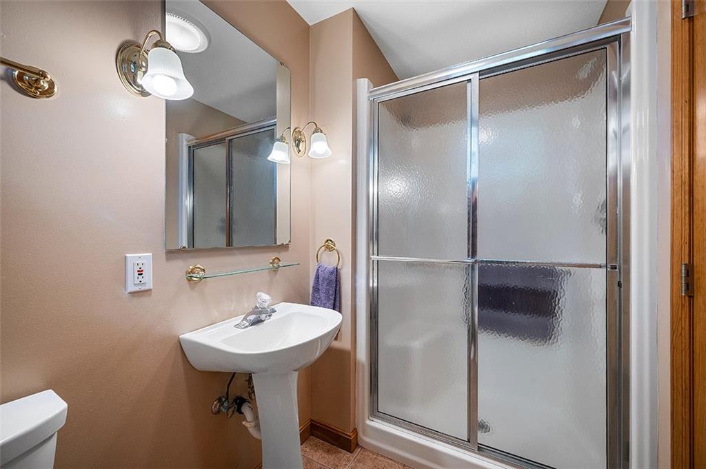 409 Bryn Court Pittsburgh, PA 15237 - Photo 37 of 50 a bathroom with a sink and a mirror