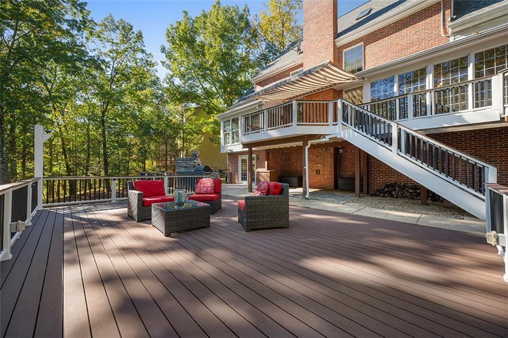 409 Bryn Court Pittsburgh, PA 15237 - Photo 42 of 50 a view of a deck with couches table and chairs with wooden floor
