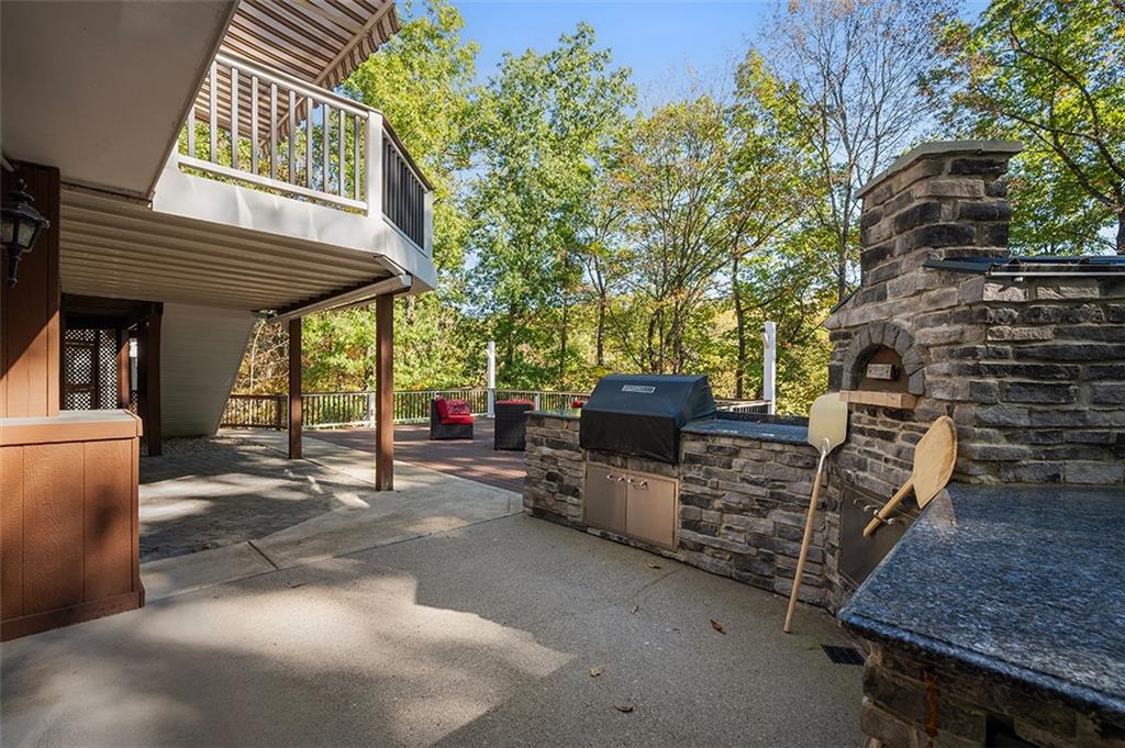 409 Bryn Court Pittsburgh, PA 15237 - Photo 43 of 50 a view of a porch with furniture and a fire pit
