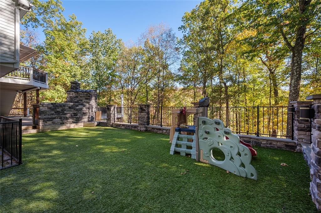 409 Bryn Court Pittsburgh, PA 15237 - Photo 44 of 50 a view of a backyard with table and chairs a barbeque and a large tree