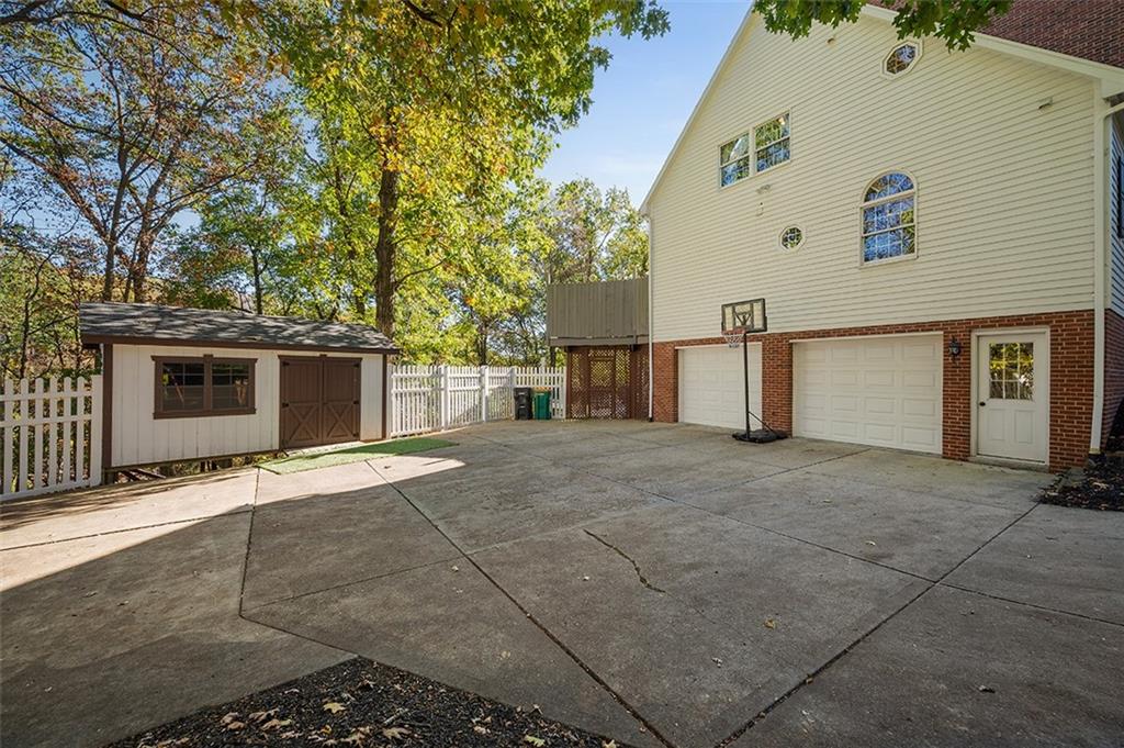 409 Bryn Court Pittsburgh, PA 15237 - Photo 49 of 50 a view of a house with a yard and garage