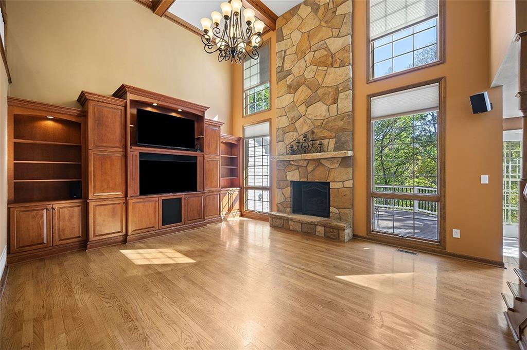 409 Bryn Court Pittsburgh, PA 15237 - Photo 6 of 50 a view of an empty room with a fireplace and a window