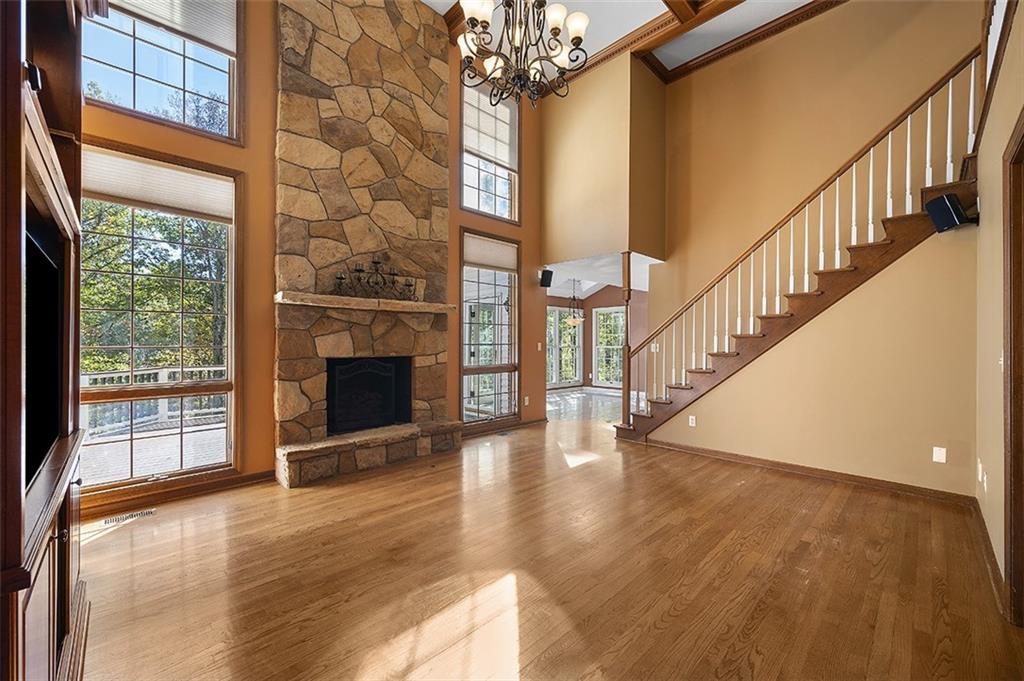 409 Bryn Court Pittsburgh, PA 15237 - Photo 9 of 50 a view of a livingroom with wooden floor a fireplace and window