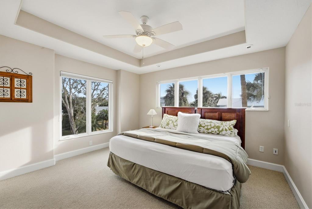 761 Norton Street Longboat Key, FL 34228 - Photo 28 of 66 a bedroom with a large bed and a window