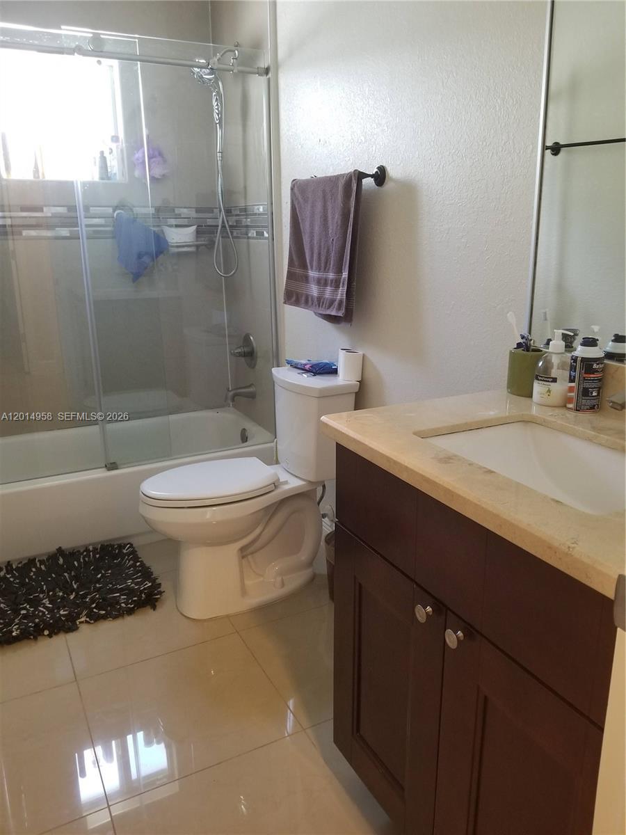 1935 Northwest 96th Street Miami, FL 33147 - Photo 6 of 7 a bathroom with a sink toilet and shower