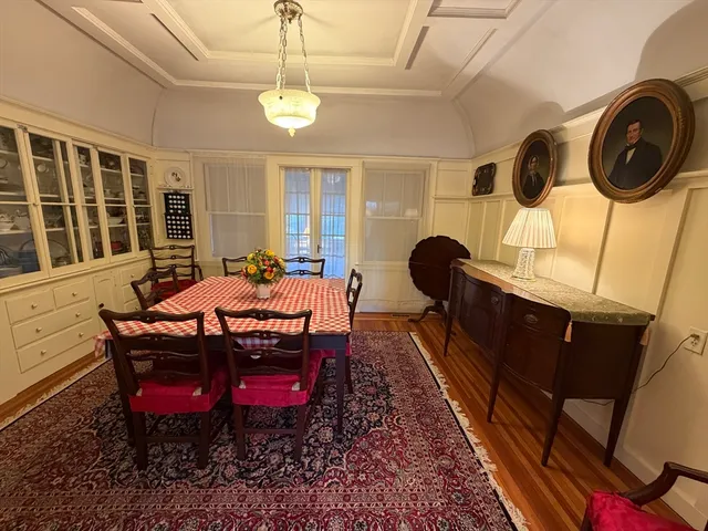 a kitchen with a refrigerator and a stove top oven