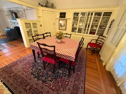 a bedroom with furniture window and dresser