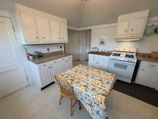 a kitchen that has a sink and a stove in it