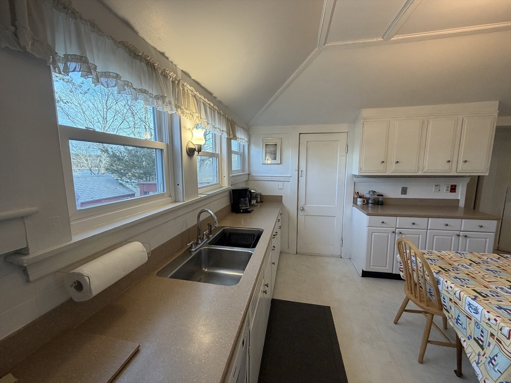 630 Washington Street, Unit 1 Gloucester, MA 01930 - Photo 17 of 28 a kitchen that has a sink and a stove in it