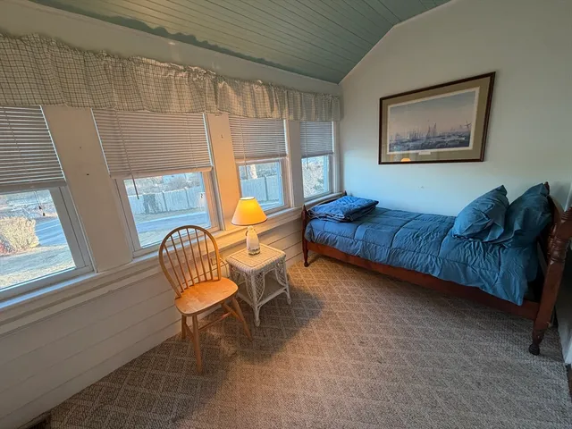 a view of an empty room with a large window