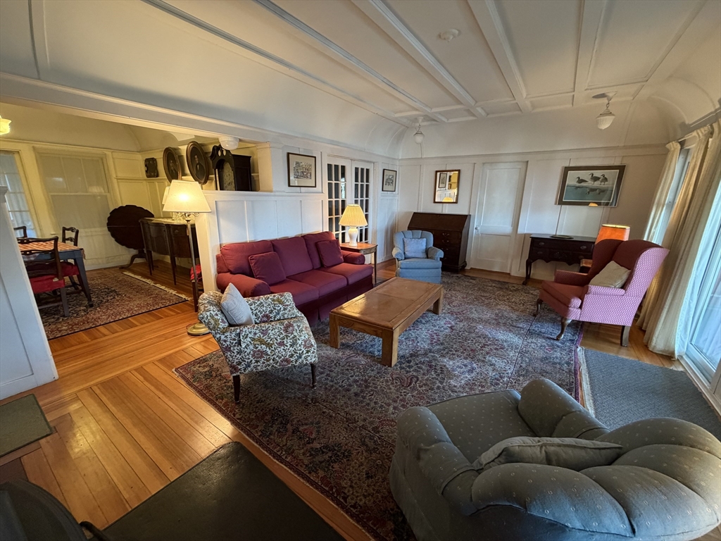 630 Washington Street, Unit 1 Gloucester, MA 01930 - Photo 6 of 28 a living room with furniture and wooden floor
