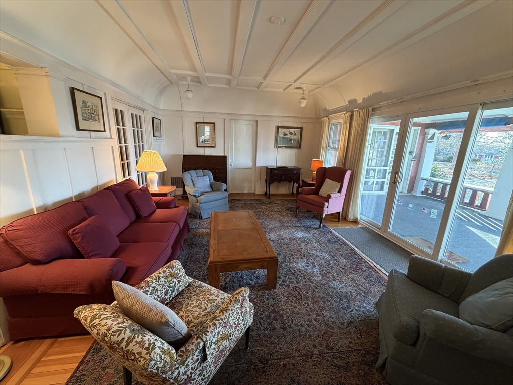 630 Washington Street, Unit 1 Gloucester, MA 01930 - Photo 7 of 28 a living room with furniture and a flat screen tv