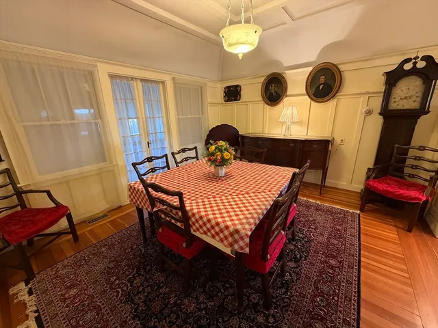 a dining room with a table and chairs